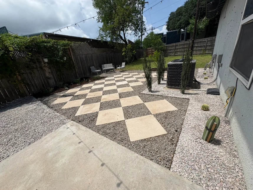 Backyard renovation with a new checkerboard paver patio set in gravel